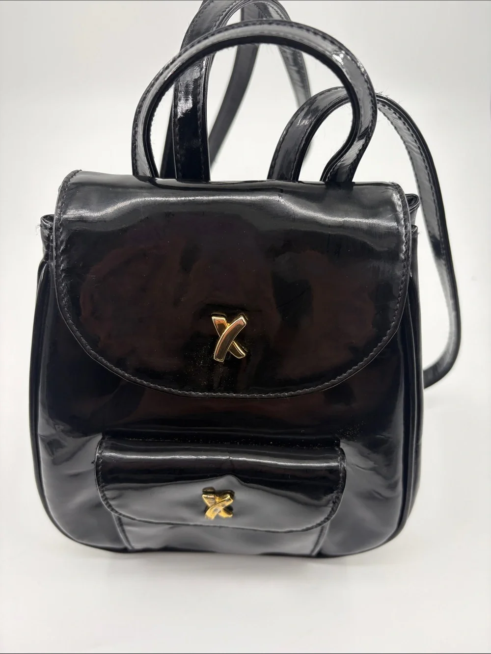 Paloma Picasso Black Patent Mini Backpack with Gold X Hardware